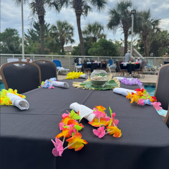 Wooden sign in the shape of a pumpkin that says welcome